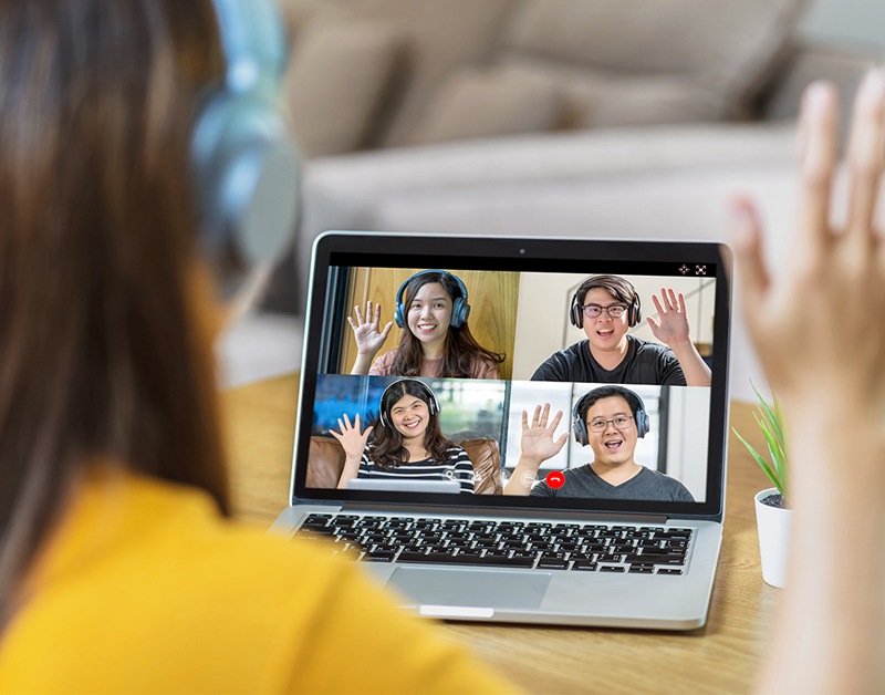 girl waving online meeting